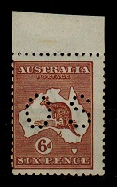 AUSTRALIA - 1929 6d chestnut U/M PERFORATED OS and with BROKEN LEG variety.  SG 0114.