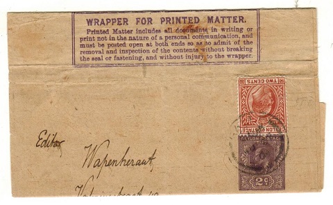 CEYLON - 1909 2c dark violet postal stationery wrapper (creased) uprated to Holland.  H&G 8.
