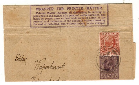 CEYLON - 1909 2c dark violet postal stationery wrapper (creased) uprated to Holland.  H&G 8.